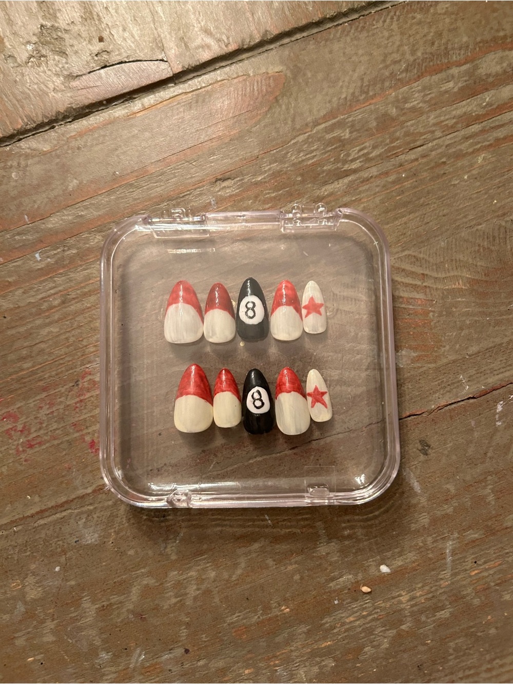 Handmade red, beige and black 8-ball press-on nail set.